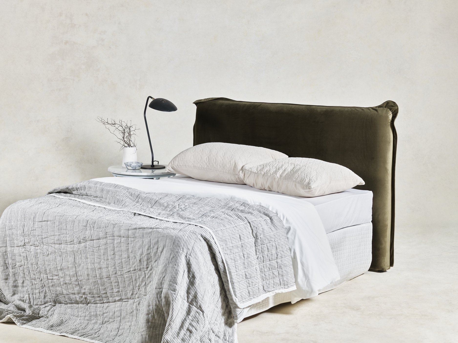 A Bedhead draws the focal point in the bedroom